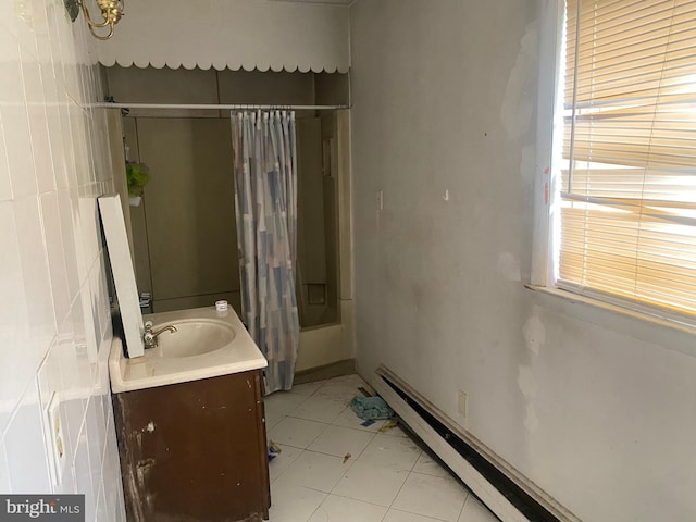 full bathroom with tile patterned floors and vanity