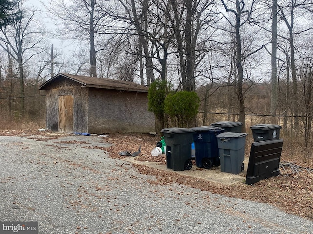 view of side of property with an outbuilding