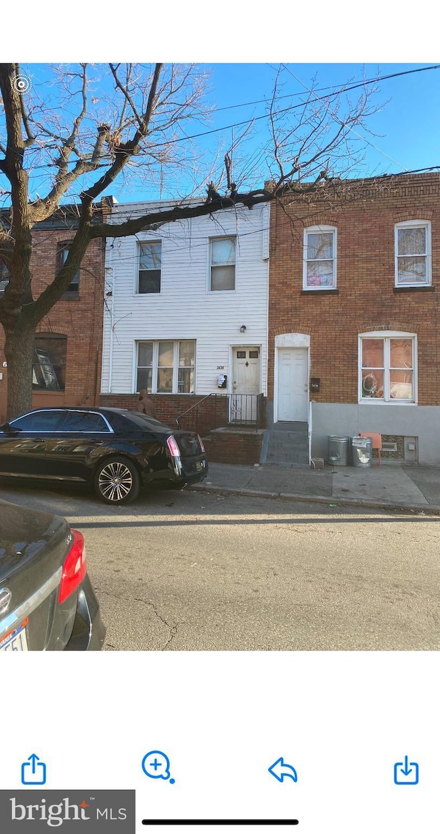 view of front of property with cooling unit