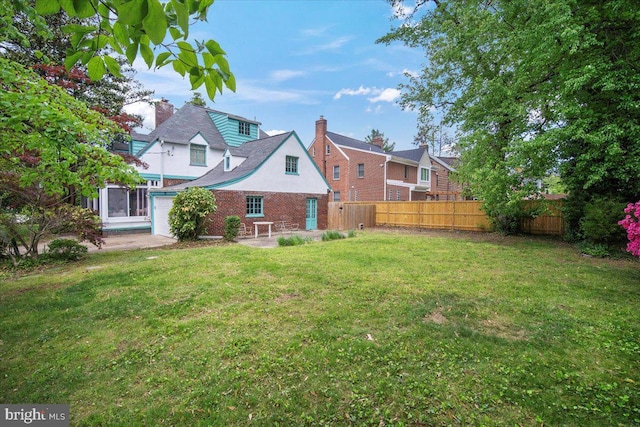 view of yard featuring fence and a patio area