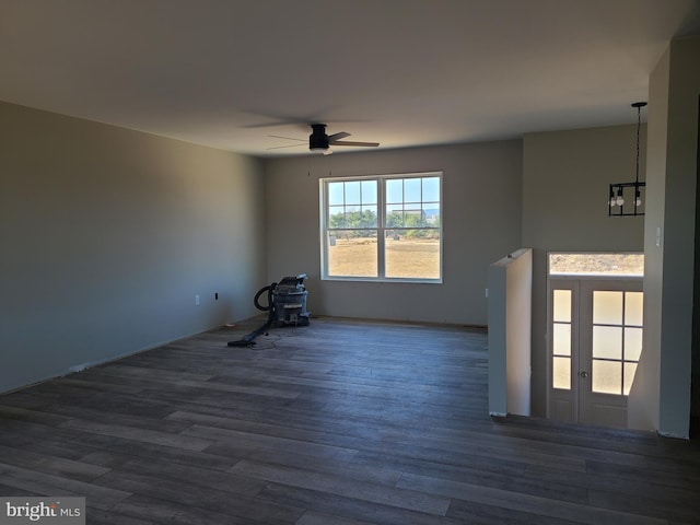 spare room featuring wood finished floors and a ceiling fan