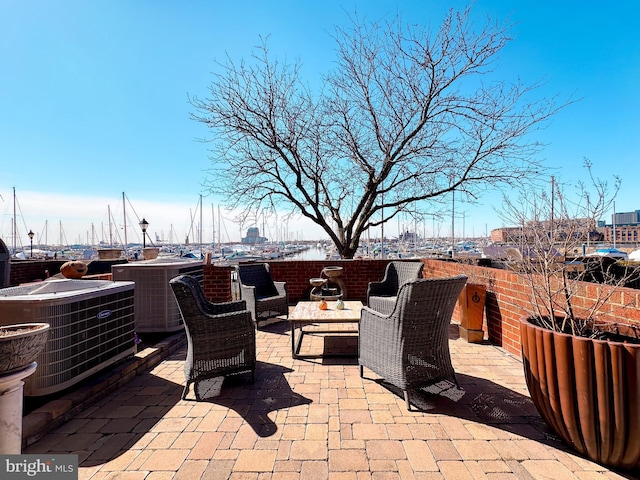 view of patio featuring cooling unit and outdoor lounge area