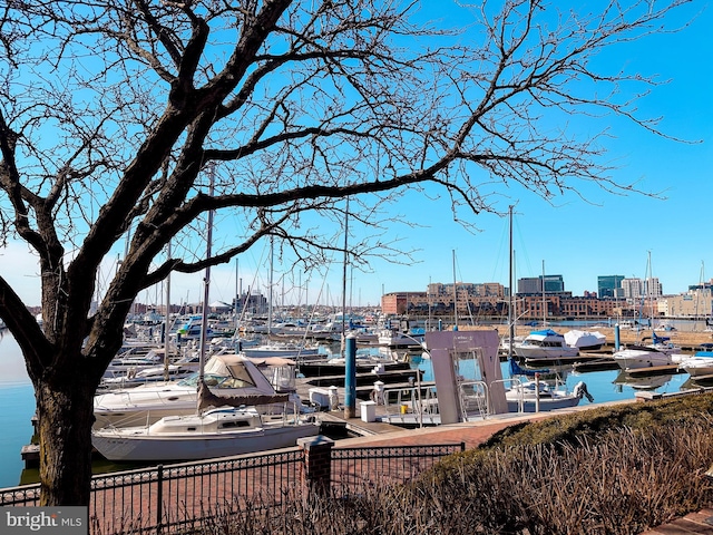 exterior space with a city view and a water view