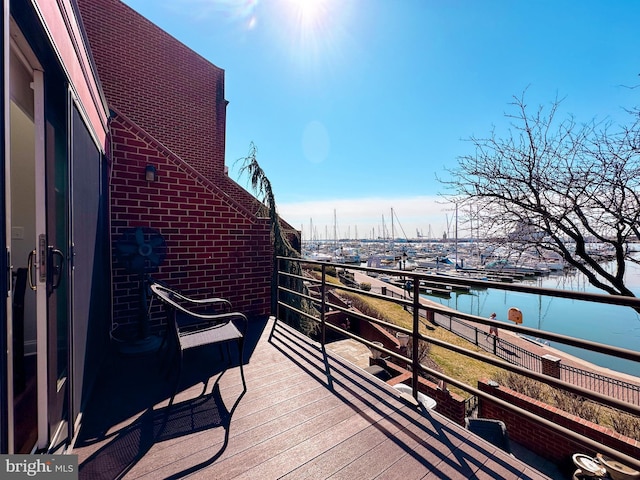 balcony featuring a water view