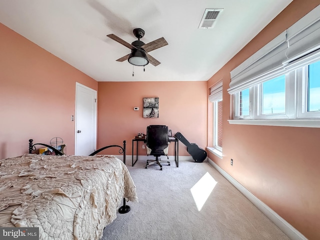 bedroom with visible vents, baseboards, carpet, and a ceiling fan