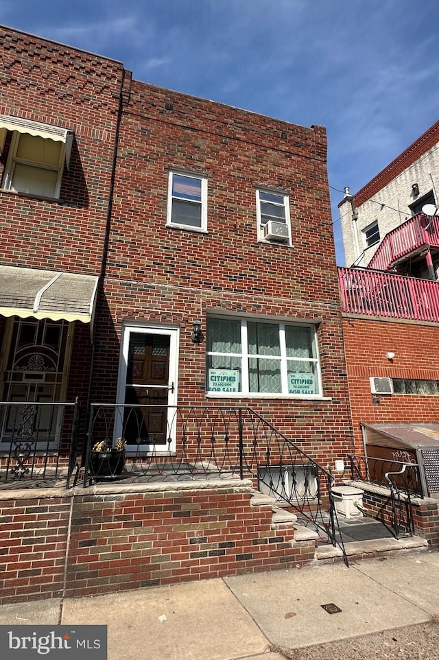 view of front of home featuring brick siding