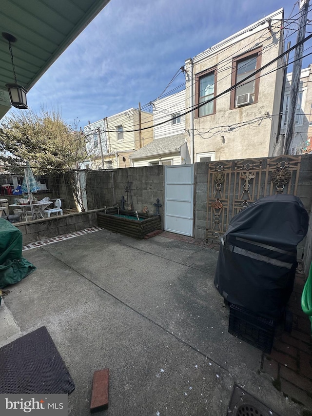 view of patio / terrace featuring fence private yard and a gate