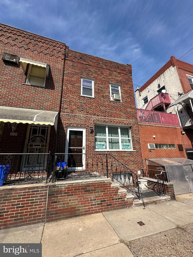 view of front of house featuring brick siding