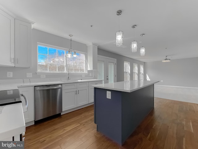 kitchen with light wood-style flooring, white cabinetry, and stainless steel dishwasher