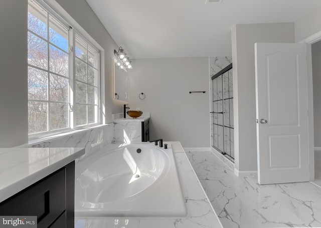 bathroom featuring a shower stall, a healthy amount of sunlight, and marble finish floor