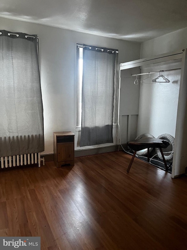 unfurnished bedroom featuring wood finished floors