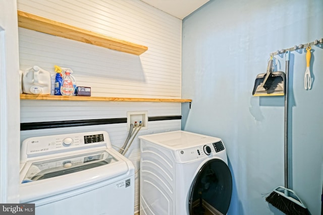 laundry area with laundry area and washer and clothes dryer