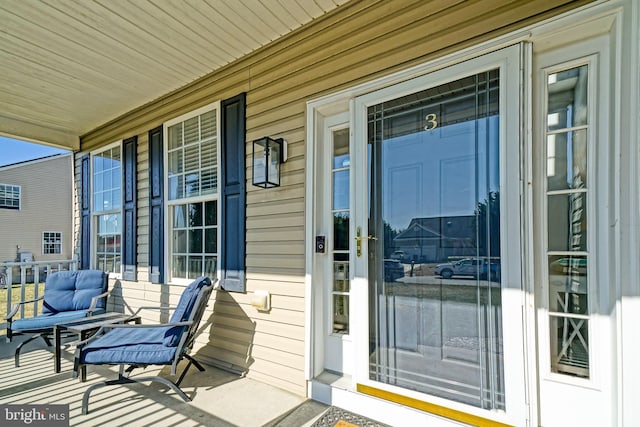 doorway to property with a porch