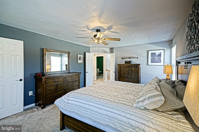 carpeted bedroom featuring a ceiling fan