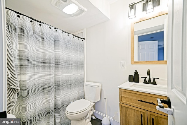 bathroom featuring vanity, curtained shower, toilet, and baseboards