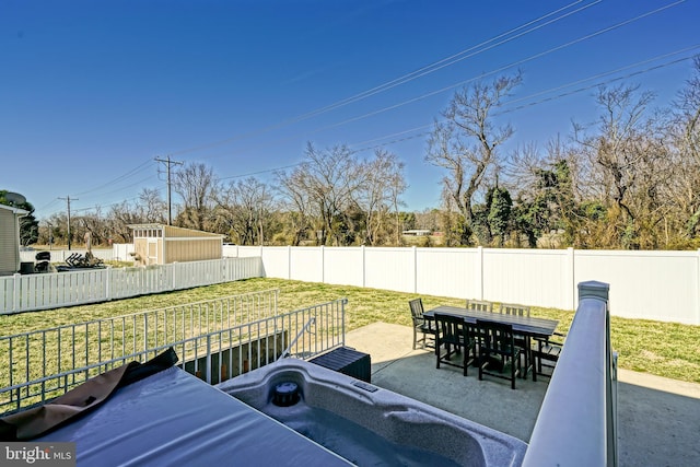 exterior space with outdoor dining area and a fenced backyard