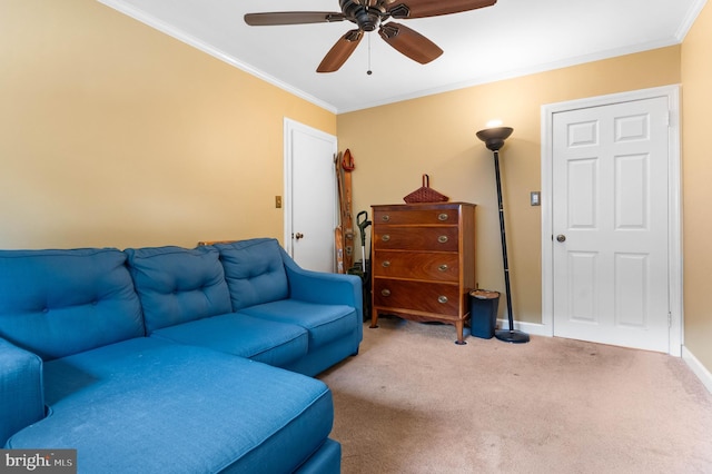 carpeted living area featuring crown molding, baseboards, and ceiling fan