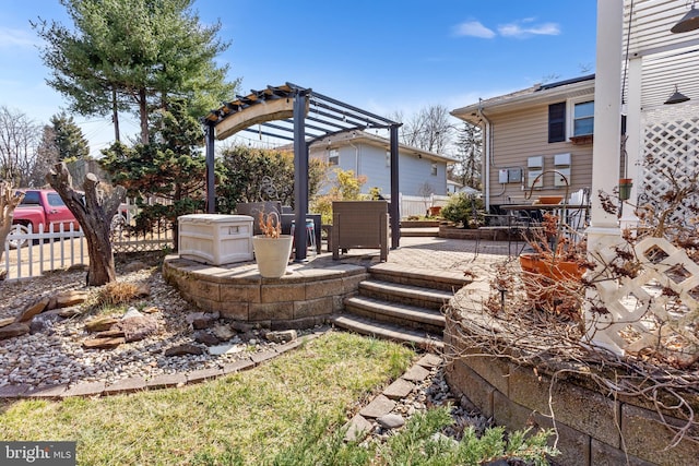 view of yard with a patio area, a pergola, and fence