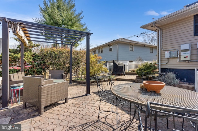 view of patio / terrace featuring outdoor dining area, fence, and a pergola