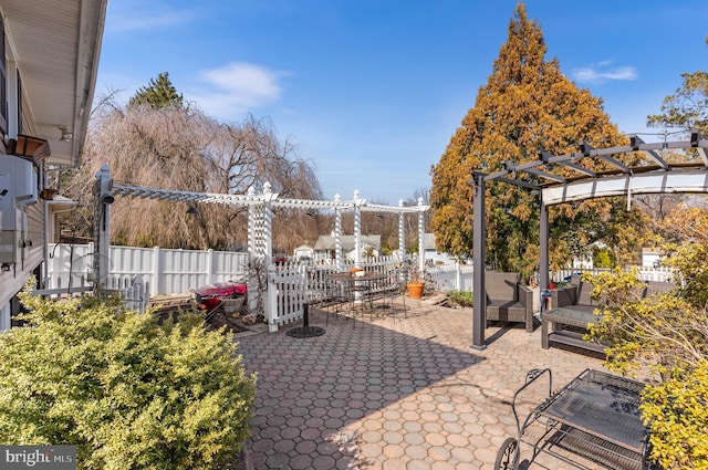 view of patio with fence and a pergola