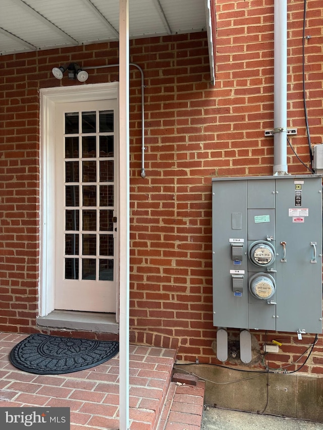 property entrance with brick siding