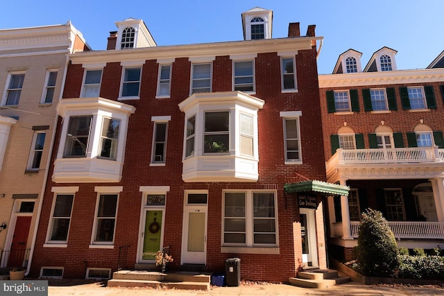 view of property with brick siding