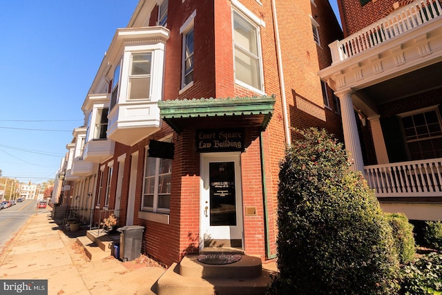 exterior space with brick siding