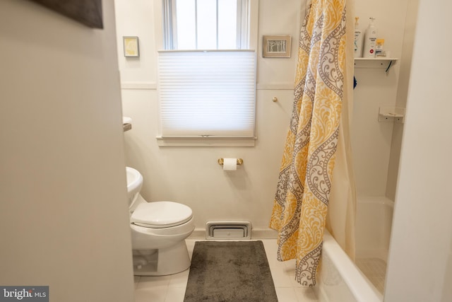 bathroom with toilet and tile patterned flooring