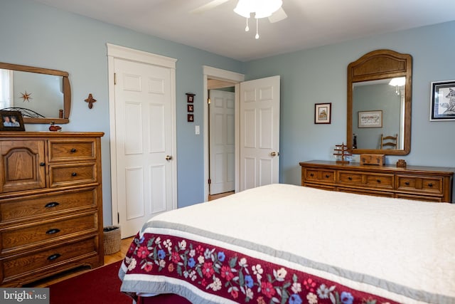 bedroom featuring a ceiling fan and wood finished floors