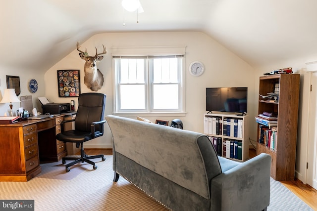 office area with a ceiling fan, light wood-style floors, and lofted ceiling