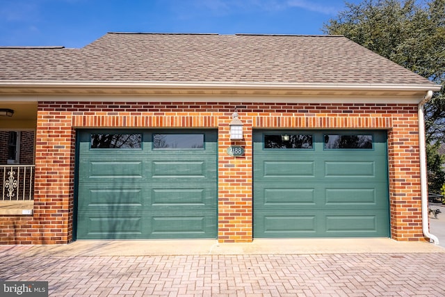 garage featuring decorative driveway