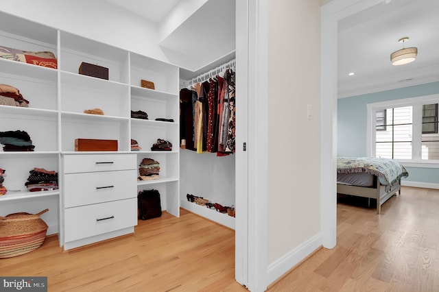 spacious closet with light wood-style floors