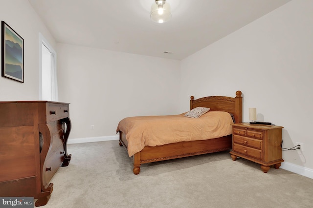 bedroom featuring carpet floors, baseboards, and visible vents
