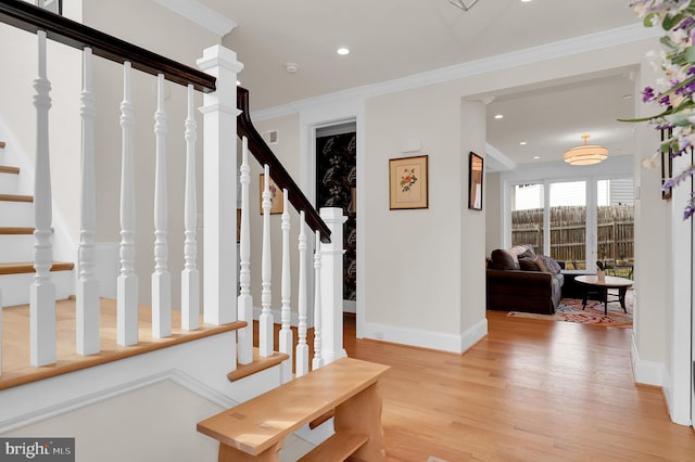 entrance foyer with baseboards, stairs, ornamental molding, recessed lighting, and light wood-type flooring