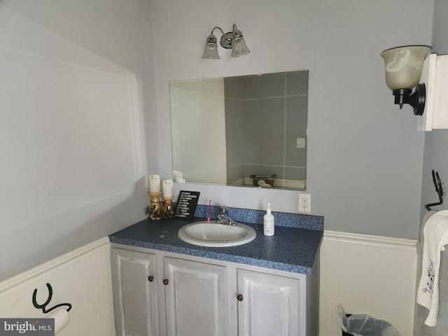 bathroom with vanity and wainscoting