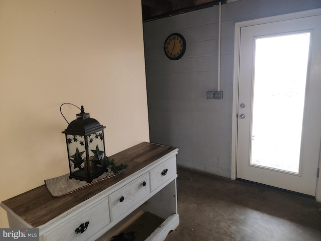 doorway with concrete floors