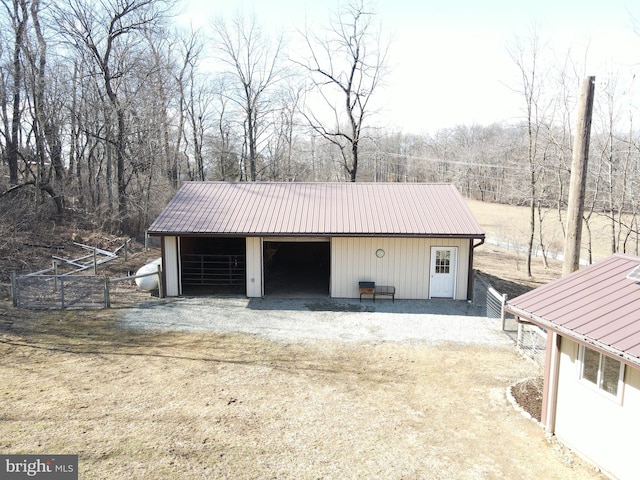 view of outbuilding with an outdoor structure and dirt driveway