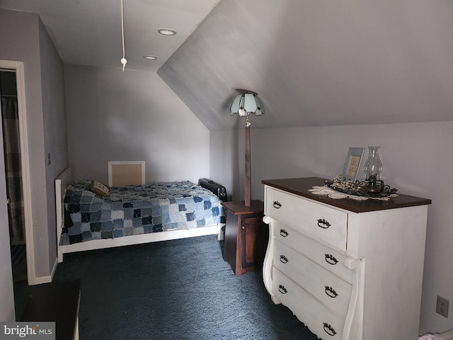 unfurnished bedroom with lofted ceiling and carpet floors