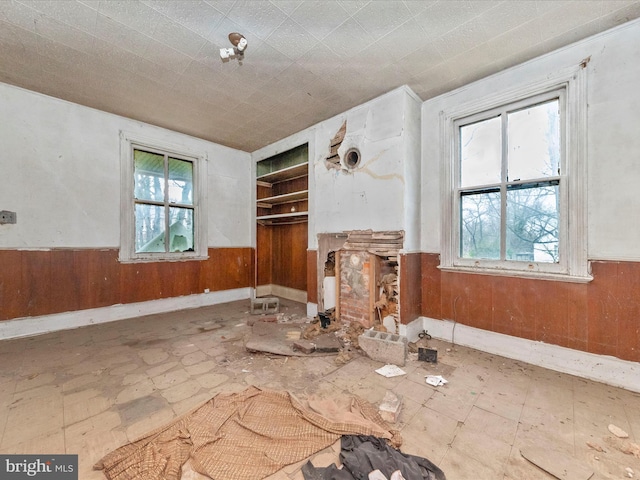 interior space with wood walls and wainscoting