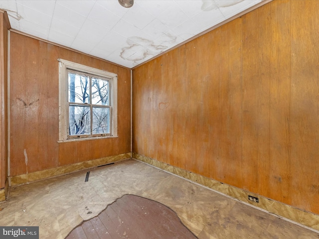 empty room with wooden walls