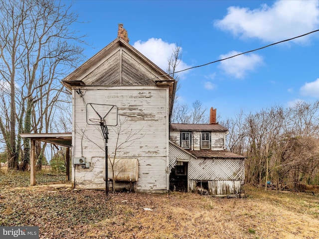 exterior space featuring a chimney