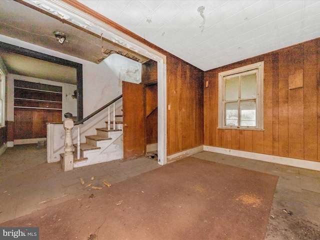 unfurnished living room with stairs