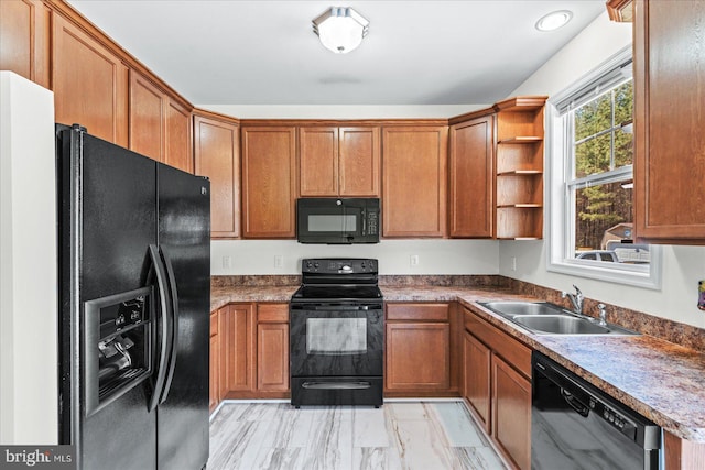 kitchen featuring brown cabinets, open shelves, black appliances, and a sink