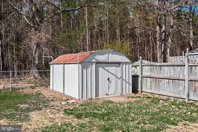 view of shed with a fenced backyard