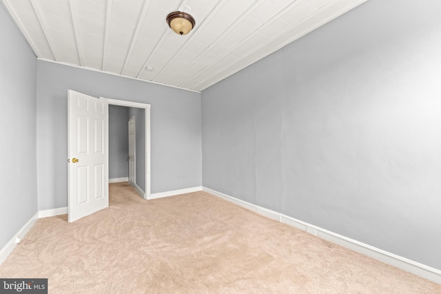 unfurnished bedroom with carpet and baseboards