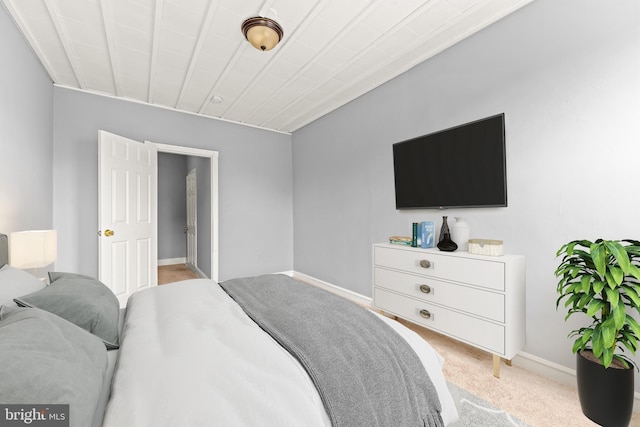 carpeted bedroom with baseboards