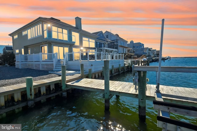 dock area with a water view