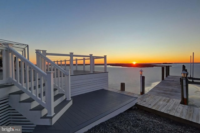 view of dock featuring a water view and stairs