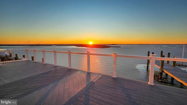 view of dock featuring a deck with water view