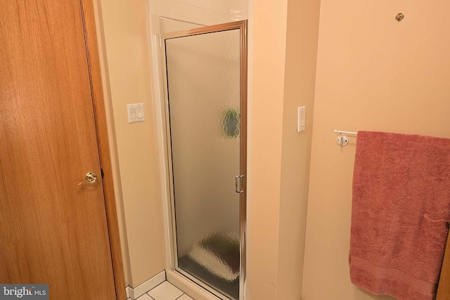 full bath featuring a shower stall